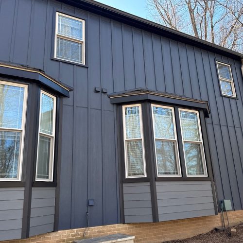 3-panel-bay-windows-dark-blue-siding Casement Window Replacement